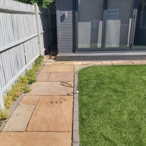 After: back garden patio and lawn cleared of rubbish